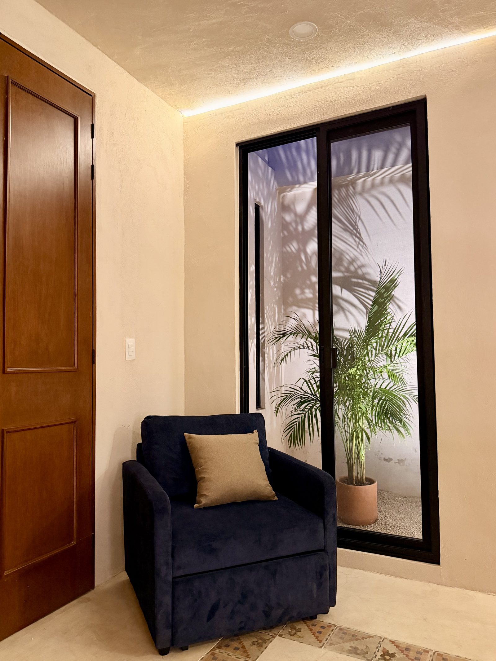 Reading nook by the tall windows